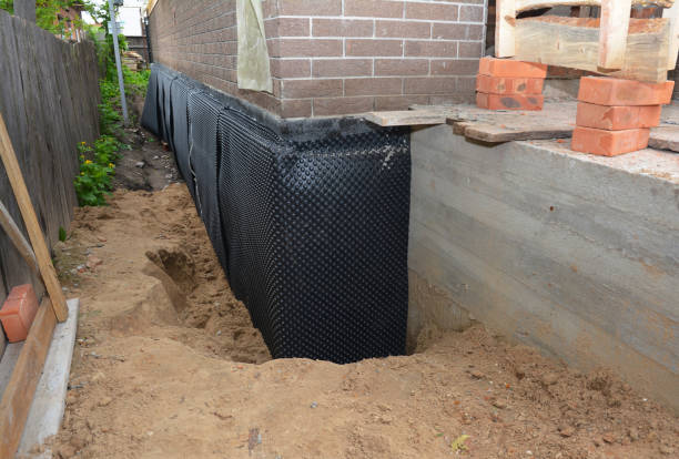 Happy homeowners after waterproofing job in Ansonia